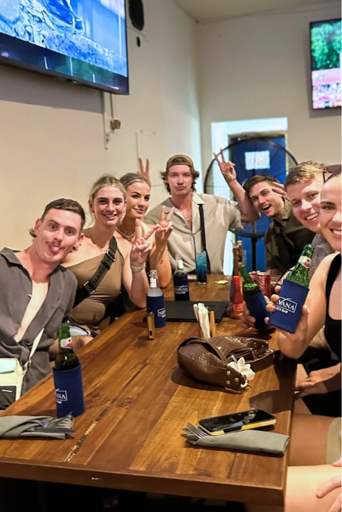 Group of people watching sports in a sports bar